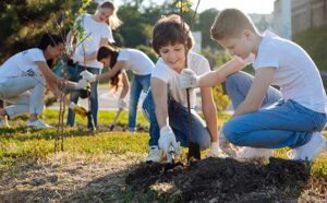 terrapass coin photo of people planting to offset carbons