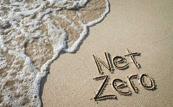 Net-zero Emissions | Illustration of Writing on Sandy Beach