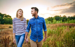 nature lovers enjoying a walk thru field